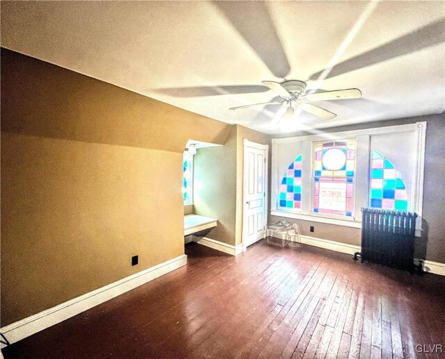 55 S Walnut St, Lansford Borough, PA 18232 - unfurnished bedroom with ceiling fan, lofted ceiling, baseboards, radiator, and wood-type flooring