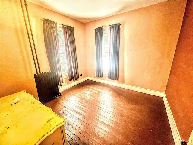 55 S Walnut St, Lansford Borough, PA 18232 - unfurnished room featuring radiator heating unit, baseboards, and wood-type flooring