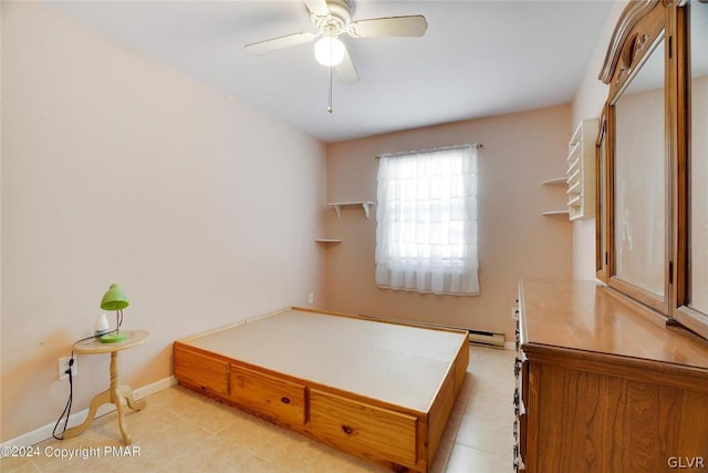 bedroom with light tile patterned flooring and baseboard heating