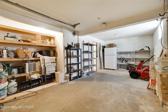 garage featuring white fridge