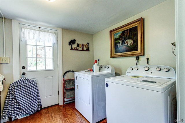 washroom featuring wood-type flooring and washer and dryer