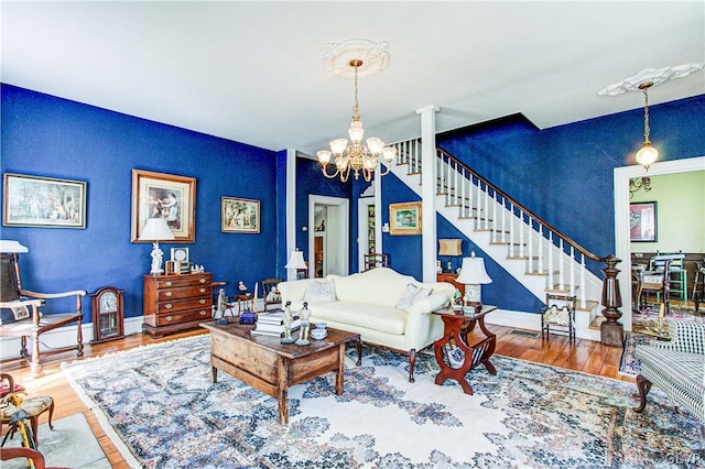 living room with hardwood / wood-style flooring and a chandelier