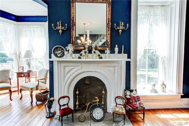 interior space featuring hardwood / wood-style flooring and a notable chandelier