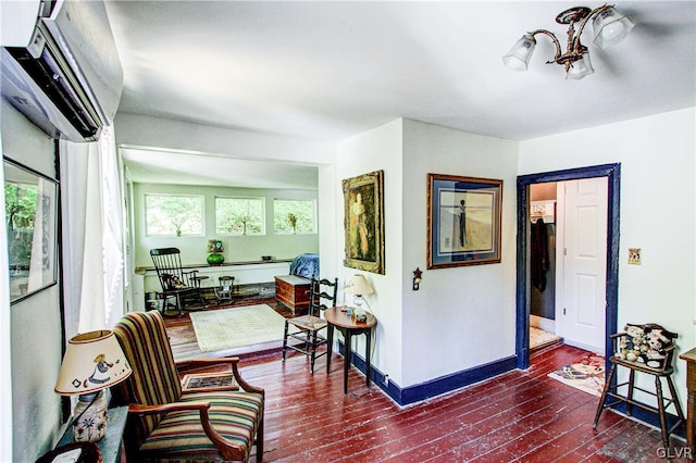 sitting room featuring a wall mounted air conditioner