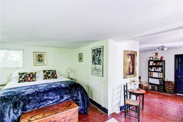 bedroom with hardwood / wood-style floors