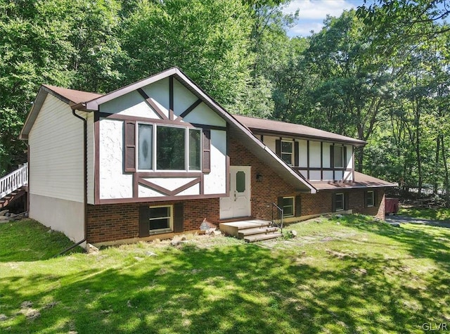 tudor house featuring a front yard