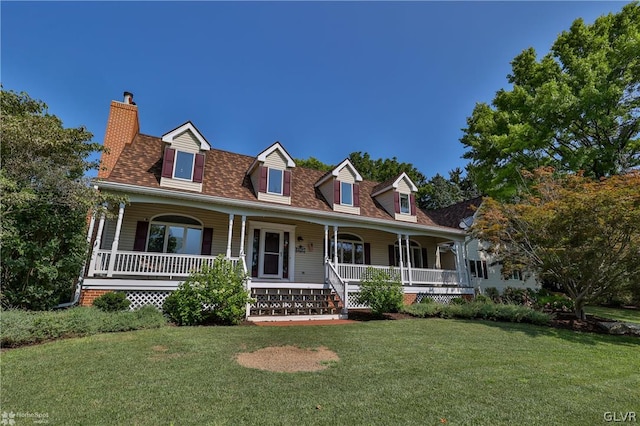 view of front of property with covered porch and a front lawn