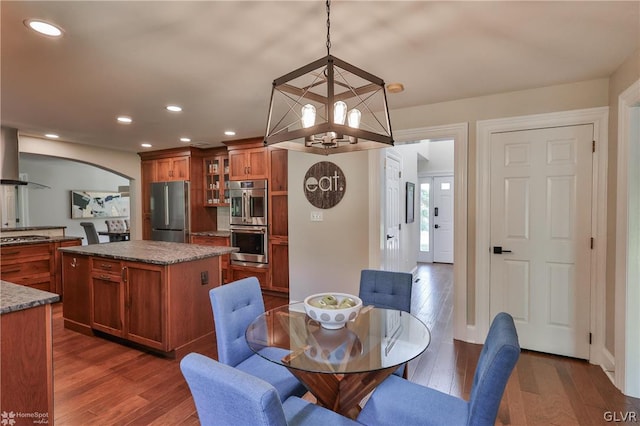 dining room with a chandelier and wood-type flooring