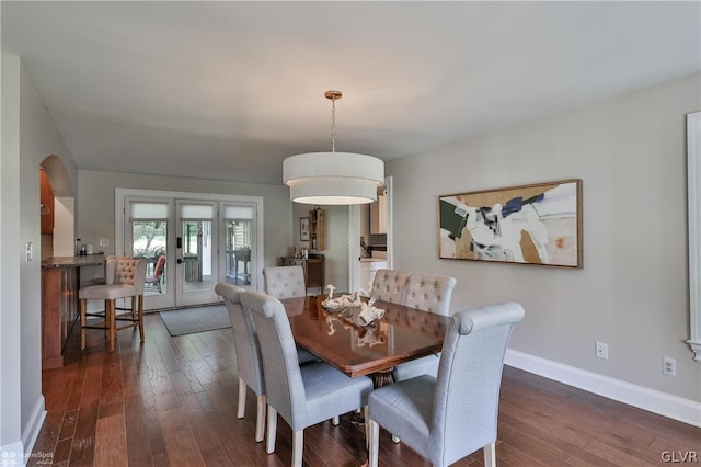 dining area featuring french doors and dark hardwood / wood-style flooring