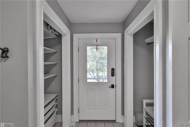 doorway to outside featuring light tile patterned floors