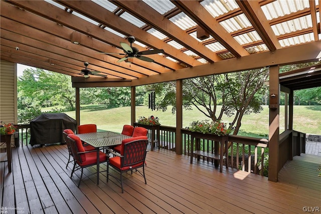 deck featuring grilling area, a pergola, and ceiling fan