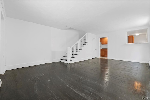 unfurnished room with dark hardwood / wood-style floors