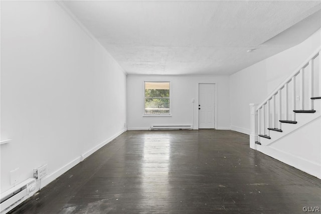 interior space featuring dark hardwood / wood-style floors and a baseboard heating unit