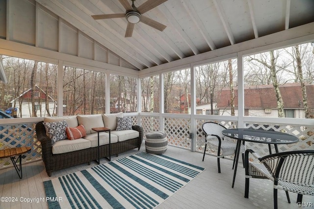 sunroom / solarium featuring vaulted ceiling and ceiling fan