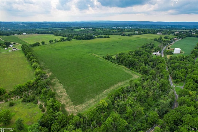 birds eye view of property with a rural view