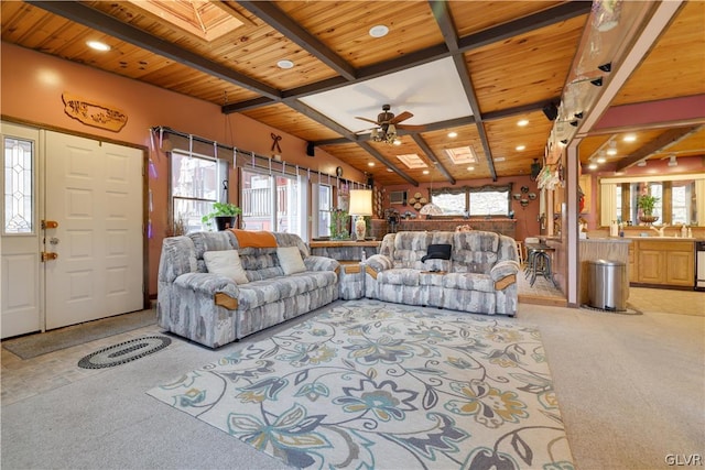 living room with light carpet, wood ceiling, and a wealth of natural light