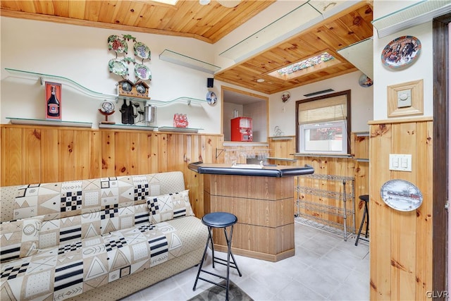 bar with backsplash, wood ceiling, and light tile patterned flooring