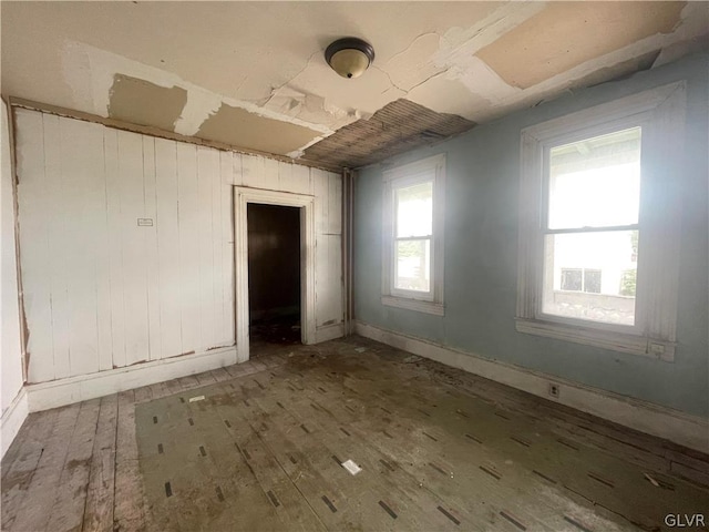 unfurnished room featuring hardwood / wood-style floors