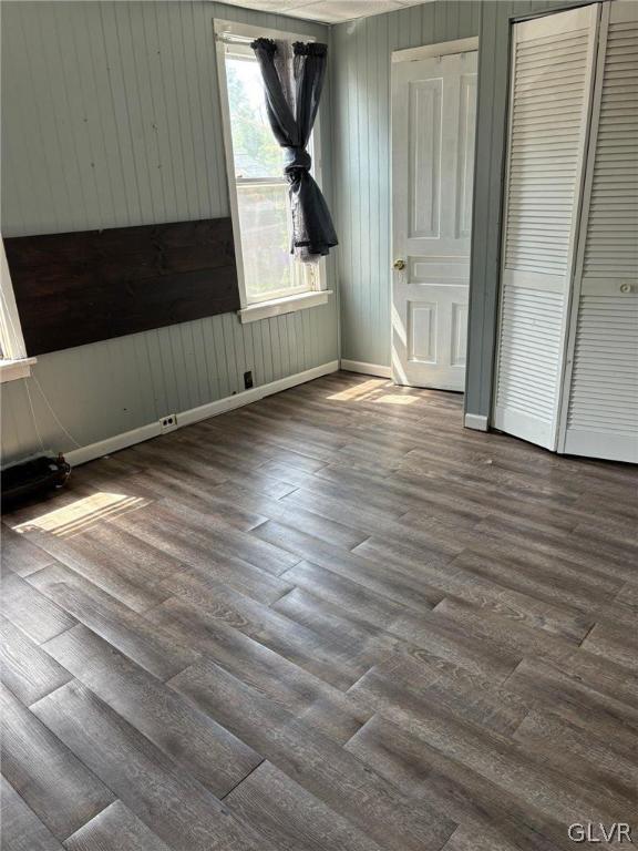 unfurnished bedroom with wood-type flooring