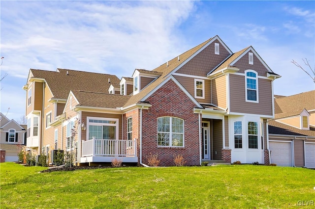 view of front of house featuring a front lawn and a garage