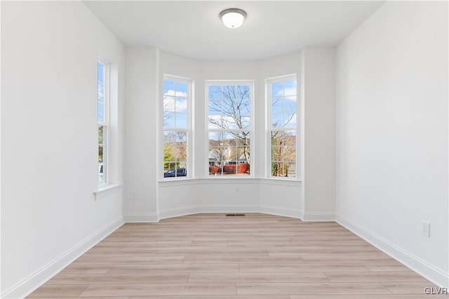 spare room featuring light hardwood / wood-style flooring