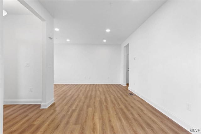 unfurnished room featuring light hardwood / wood-style flooring