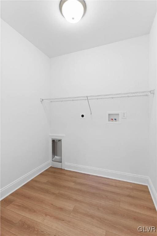 clothes washing area featuring hardwood / wood-style flooring, hookup for an electric dryer, and hookup for a washing machine