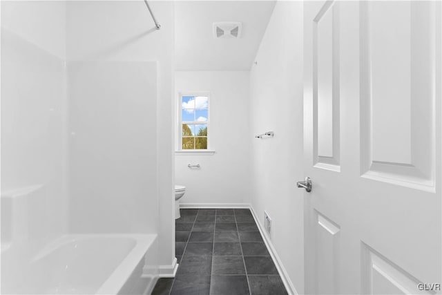 bathroom featuring tile patterned floors and toilet