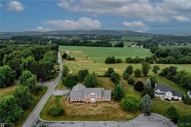 birds eye view of property featuring a rural view