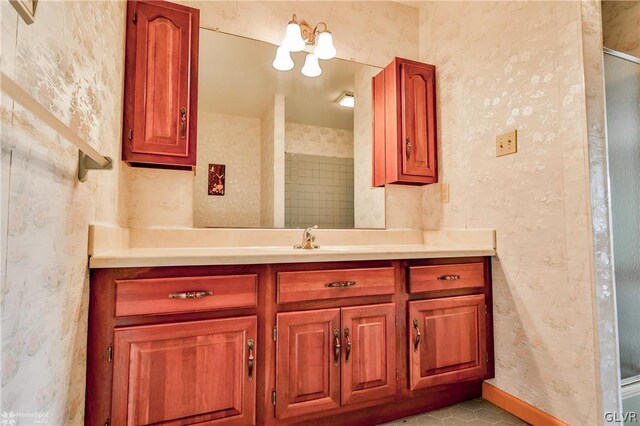 bathroom with tile patterned flooring and vanity