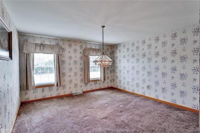 spare room featuring carpet floors