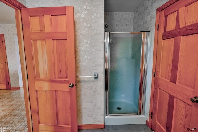 bathroom with tile patterned floors and an enclosed shower