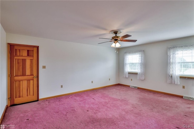 empty room with carpet flooring and ceiling fan