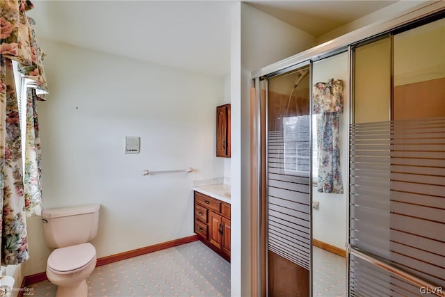 bathroom featuring tile patterned floors, toilet, and vanity