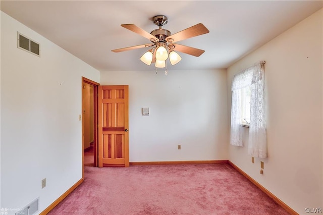 empty room with carpet flooring and ceiling fan