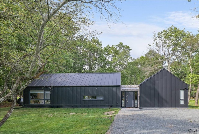 view of outbuilding with a lawn