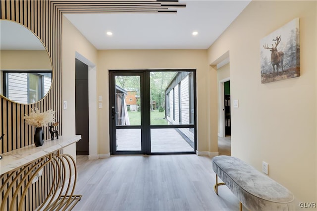 interior space with light hardwood / wood-style floors and french doors