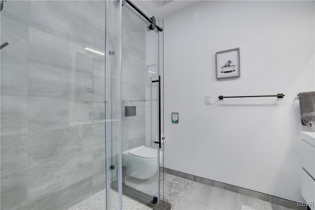 bathroom with an enclosed shower, vanity, and toilet