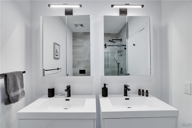 bathroom featuring vanity and a shower with shower door