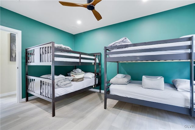 bedroom with ceiling fan and hardwood / wood-style floors