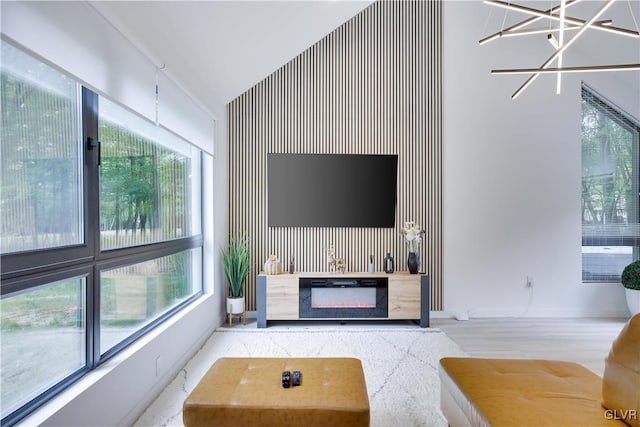 living room with vaulted ceiling and a healthy amount of sunlight