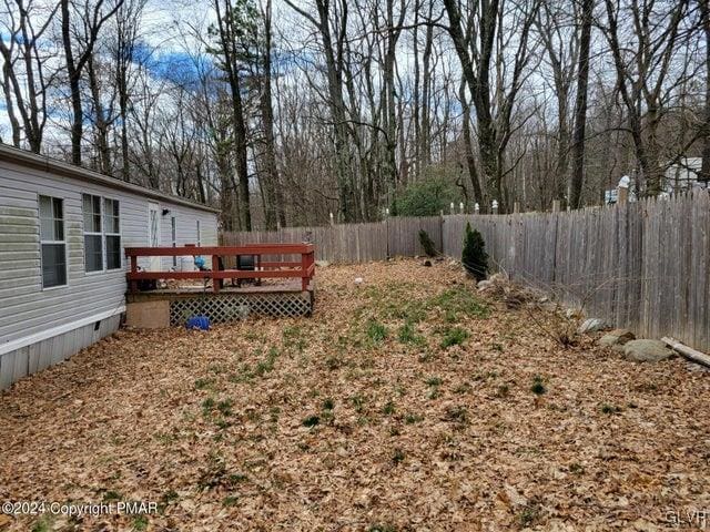 view of yard with a deck