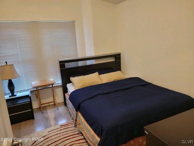 bedroom featuring wood-type flooring