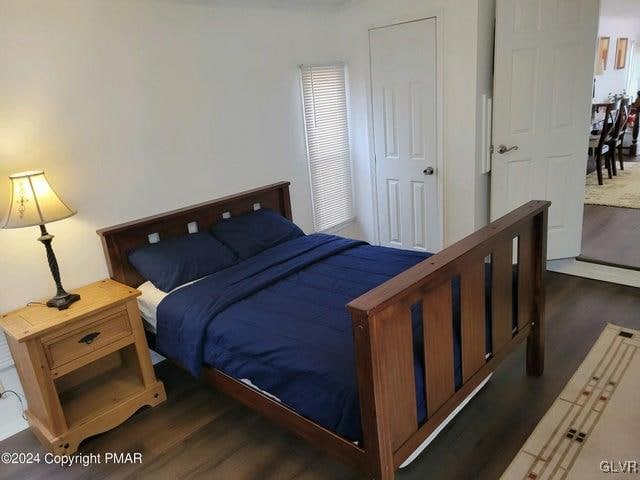 bedroom featuring dark hardwood / wood-style floors