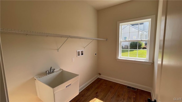 clothes washing area with washer hookup, dark hardwood / wood-style floors, and hookup for an electric dryer