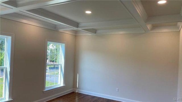 empty room featuring dark wood-type flooring, crown molding, beamed ceiling, and coffered ceiling