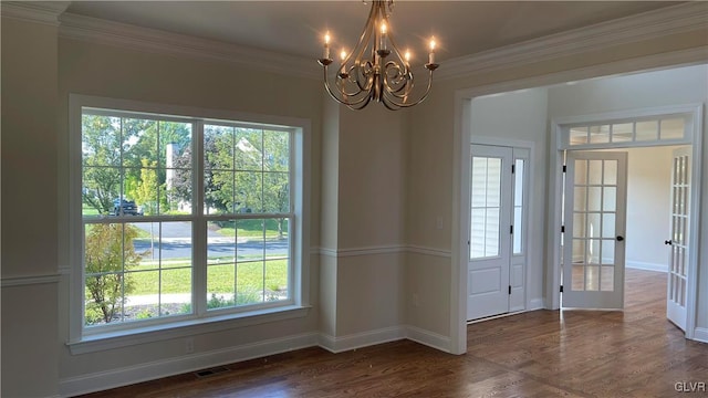 interior space with dark hardwood / wood-style floors, a notable chandelier, and a healthy amount of sunlight