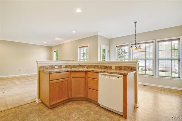 kitchen featuring a notable chandelier, decorative light fixtures, sink, dishwasher, and light tile patterned floors