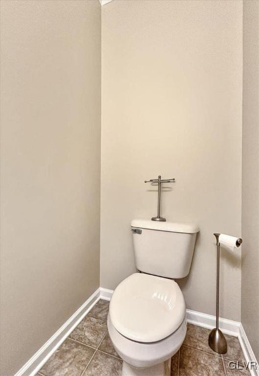 bathroom featuring tile patterned floors and toilet