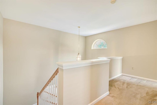 hallway with light carpet